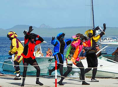Zwarte Piets dancing on the pier by Tanya Deen